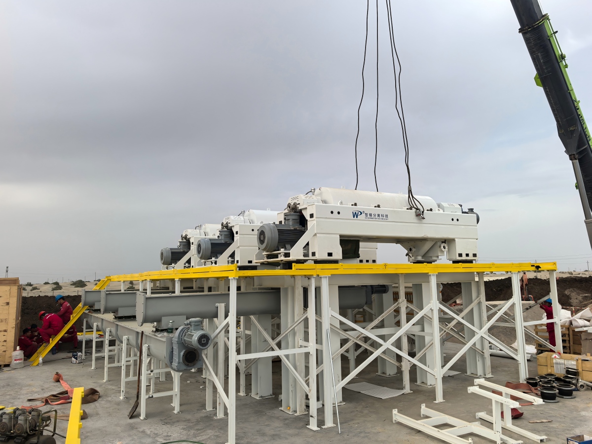 Three LWS650x2650B three-phase decanter centrifuges during installation on an elevated skid