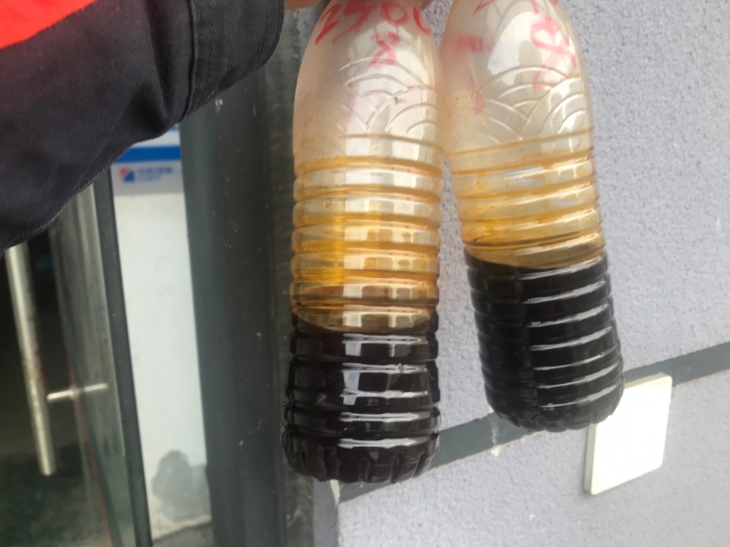 Recovered used cooking oil discharged from three-phase decanter centrifuge heavy liquid phase outlet
